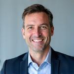 Professional headshot of John Doe, CEO